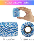 Hand holding small roll of blue and white twine, 2mm 3 strands, labeled with dimensions, for arts and crafts gift wrapping