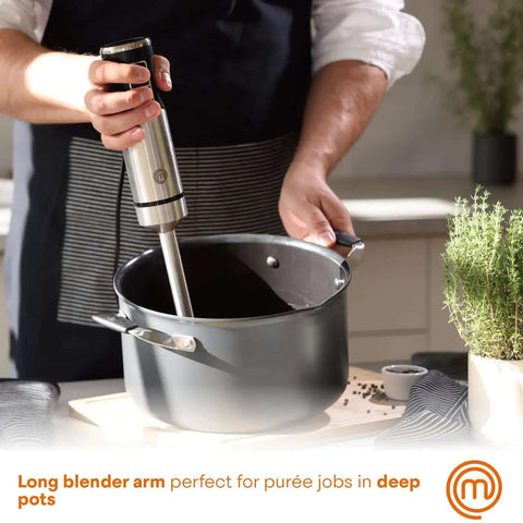 Professional Handheld Immersion Blender Featuring Powerful 400W Motor And Durable Stainless Steel Shaft Perfect For Creamy Soups Rich Sauces And Quick Daily Meal Prep Blends Effortlessly Like A Real Deal Kitchn Champion blending in deep pot.