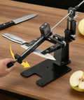 Premium Precision Knife Sharpening System With Adjustable Angle Guide Pro Grade Sharpening Kit in use, knife sharpening on table.