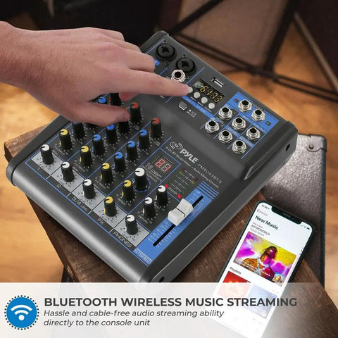 Person adjusting 4 Channel Digital USB Bluetooth Pro Audio Mixer With MP3 Playback, USB Flash and PC Input