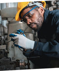 Worker inspecting Heavy Duty No Sweat Rubber Drive Belt Pair For Industrial Sealing Machines Quick Swap Guide Replacement.