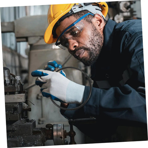 Worker inspecting Heavy Duty No Sweat Rubber Drive Belt Pair For Industrial Sealing Machines Quick Swap Guide Replacement.