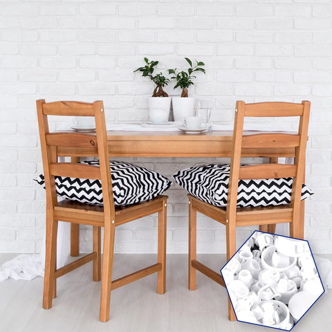 Dining room with wooden table and chairs, insert shows six sizes white plastic hole plugs set for panels and cabinets 135 pieces.