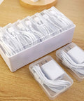 Ultimate Cable Organization Kit with 7 clear mini cases and USB wires on a wooden surface