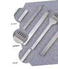 Close-up of 8-Piece Leather Craft Tool Kit with sharp rhombus-tooth punches on gray surface, showing detailed steel prongs.