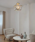 Sheldon Brass Four Light Industrial Farmhouse Semi Flush Ceiling Mount Light installed in modern living room setting