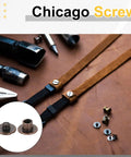 Close-up of 50 Pack Of M4 Chicago Screws With Six Millimeter Length And Solid Phillips Drive In Durable Red Copper Coating.