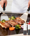 Cooking steaks and vegetables on griddle with spatulas, Griddle Accessories Kit For Blackstone Griddles, 28 Piece Hibachi Tools Set