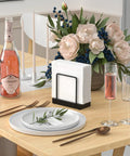Table Top Napkin Holder Made of Bamboo and Iron, Standing Dispenser for Kitchen and Dining on a decorated table setting.