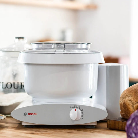 Heavy Duty Stand Mixer 500W Powerhouse With 6.5 Quart Bowl And Wire Whips And NutriMill Dough Hook Extender Bundle in a kitchen setting