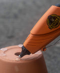 Glue gun using Clear Mini Hot Glue Sticks 4 Inch Long 0.27 Inch Diameter Pack Of 6 75 Count to repair a clay pot.