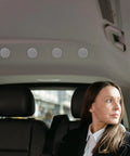 Car interior with 50 Pc Grey Flannelette Headliner Repair Pins for sagging roof ceiling fabric repair, woman in backseat.