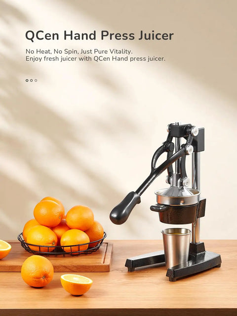 Heavy Duty Cast Iron Manual Citrus Juicer Press, Giant Orange Squeezer with fresh oranges and juice on kitchen counter.