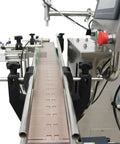 Automatic Servo Filling Machine For Pastes And Liquids Features Plug N Play Setup And No Sweat Operation Delivers Rock Solid Precision For Honey Jam Peanut Butter Sauces 100 To 1000 Ml Range close-up of filling machine conveyor system with precision controls.