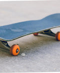 Durable Aluminum Inline Skate Spacers Kit 20 Pieces visible near skateboard on concrete surface