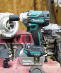 Cordless Half-Inch Impact Wrench With Detent Anvil, 18V LXT Brushless Motor, Four-Speed Power Settings, Compact Five And Five Eighths Inch Length, Tool Only, Heavy-Duty Torque Monster For Nuts placed on engine block