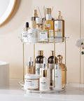 Two Tier Clear Rotating Vanity Organizer With Smooth 360 Degree Spin For Skincare And Perfume Beauty Essentials Storage, displaying various beauty products.