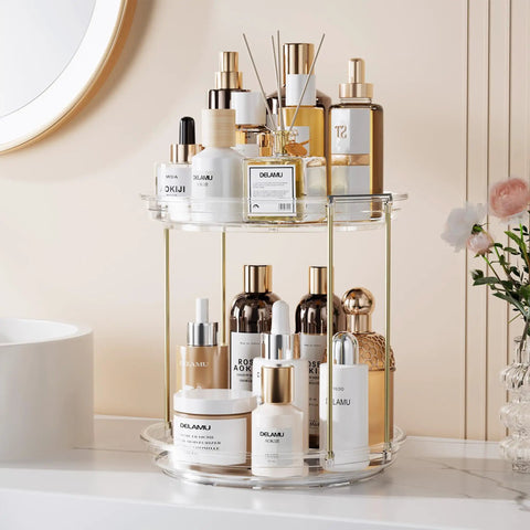 Two Tier Clear Rotating Vanity Organizer With Smooth 360 Degree Spin For Skincare And Perfume Beauty Essentials Storage, displaying various beauty products.