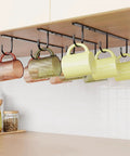Under Cabinet Mug Hooks Set, 3 Pack With 9 Hooks, Easy Cup Hanger For Displaying Coffee Mugs, Cups And Kitchen Utensils, Rust-Resistant Stainless Steel, Space-Saving Black Finish installed under a kitchen cabinet with mugs hanging