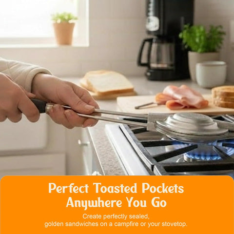 Hand holding Retro 1945 Style Handheld Cast Aluminum Sandwich Maker And Pie Iron Grill over stovetop, cooking toasted pockets.