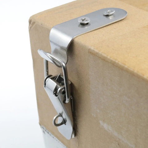 90 Degree Stainless Steel Latch Kit for toolbox and cabinet doors with keyhole lock installed on cardboard box corner