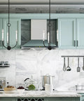 Kitchen with Two Three Light Black Chandelier With Brushed Nickel Accents From The Lucerne Collection above marble counter