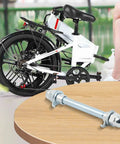 10mm Solid Steel Beefy Hub Axle for Electric Bikes next to folded white e-bike and black wheels