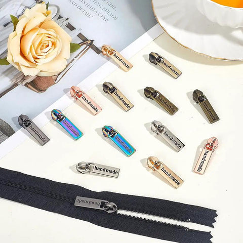 14 Piece Zipper Pull Replacement Kit With Seven Colors Alloy Rectangular Slider Heads For Purses Luggage Bags And Sewing Projects Durable Zipper Pulls For Quick Fixes And A Dope Gift displayed on table