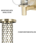 Close-up of Vintage Brushed Brass Vanity Light With Clear Glass Globe Lampshades showing metal texture and honeycomb detail.