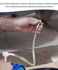 User holds Smooth Shift Fluid Pump For Standard Quart Jugs And Transmission Sump With 4Cc Per Stroke Differential Gear Oil for easy transfer.