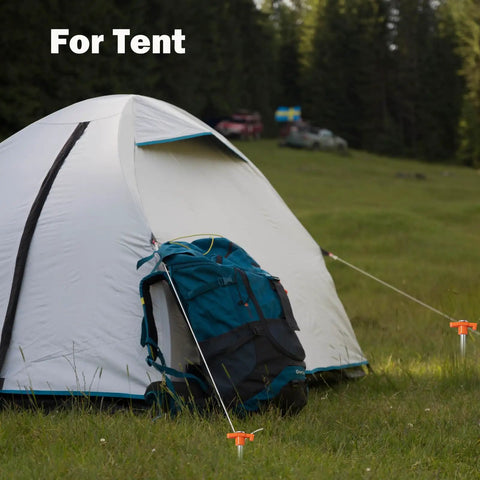 Heavy Duty Tent Stakes 20 Pack 9.75 Inch Ground Pegs securing a tent in a grassy field with orange T-shaped tops.