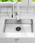 Modern kitchen sink with stainless steel finish, featuring the Gold Kitchen Sink Drain Assembly With Deep Removable Waste Basket, Strainer And Stopper For Three And A Half Inch Openings, Fits Stainless Steel And Quartz Farmhouse Sinks.