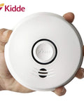 Hand holding Smoke And Carbon Monoxide Detector With 10 Year Battery And Voice Alert Interconnected Combo Alarm For Your Home Safety