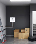 Top Shelf Electric Tankless Water Heater 36Kw 240V mounted on wall in garage with storage boxes and a ladder.