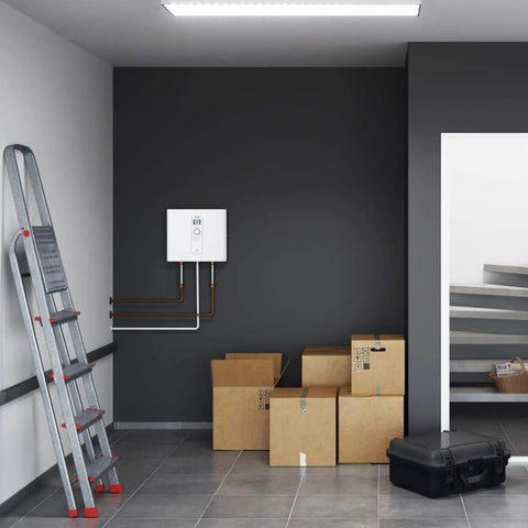 Top Shelf Electric Tankless Water Heater 36Kw 240V mounted on wall in garage with storage boxes and a ladder.