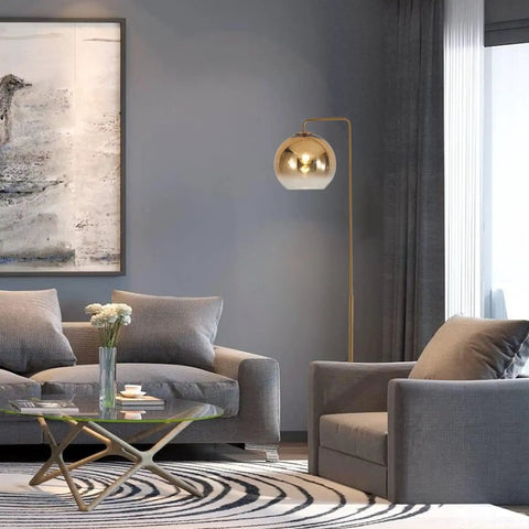 Gradient Gold Floor Lamp With Glass Globe LED Standing Light in a modern living room setting