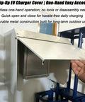 Heavy Duty Universal EV Charger Cover Built Like A Tank With Flip Up Lid Weatherproof Rain Snow UV Shield For Electric Vehicle Wall Mount Protector Shields Your Ride From Frostbite, showing one-hand operation with durable metal lid.