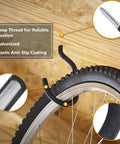 Close-up of heavy-duty bicycle hanger with deep threaded hook for garage wall or ceiling, holding bike wheel safely.