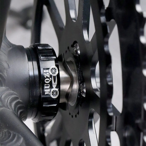 Close-up of Steel Bike Bottom Bracket Wave Washers Set For 24mm And 30mm Cranks installed on a bicycle