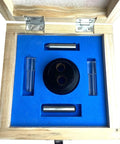 Hella Accurate Optical Center Punch Set With 9X Magnifying Bullseye And Crosshair Lenses inside wooden crate, featuring black and steel components.