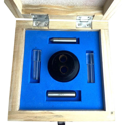 Hella Accurate Optical Center Punch Set With 9X Magnifying Bullseye And Crosshair Lenses inside wooden crate, featuring black and steel components.