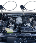 Two Pack 304 Stainless Steel Ball Locking Pins With Quick Release Push Button And 24 Cm Lanyard Cable, shown over a car engine