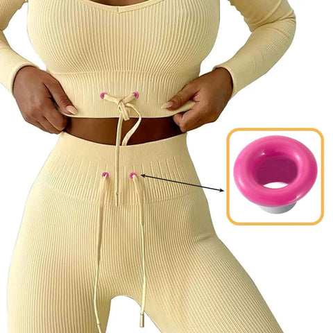 Close-up of a model using 60 Sets Metal Grommets Kit With 3mm Round Eyelets in pink on beige fabric, highlighting DIY apparel use.