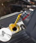 Close-up of oil being poured into engine with inset showing Must Have Heavy Duty 45 Piece Metric Grease Fittings Kit With M6 M8 M10