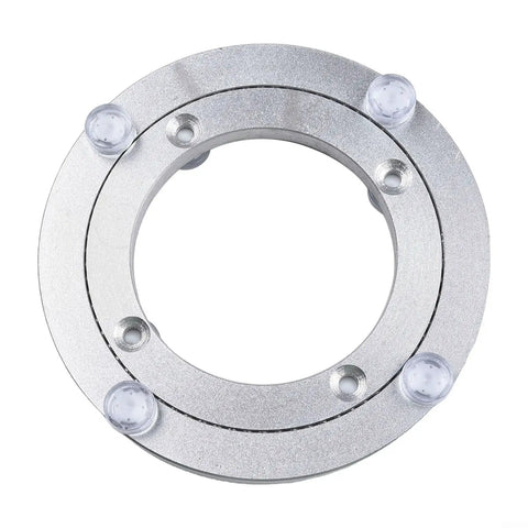 Top view of 5-Inch Rotating Bearing Turntable Base in silver, aluminum alloy, with visible ball bearings for cake decorating.