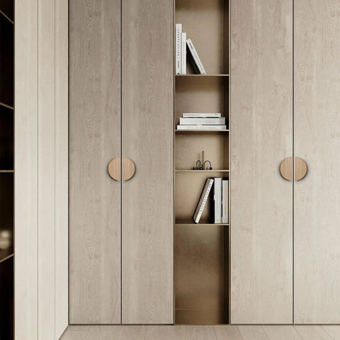 Walnut Wood Circular Cabinet Drawer Pulls Four Pairs Round Wood Grain Handles installed on light wood cabinets in a modern kitchen