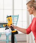 350W Brushless Paint Sprayer Yielding Hella Smooth Finish And No Sweat Operation For DeWalt Batteries Ships With Four Copper Nozzles For Snappy Fence Wall Diy Makeovers in use by a woman