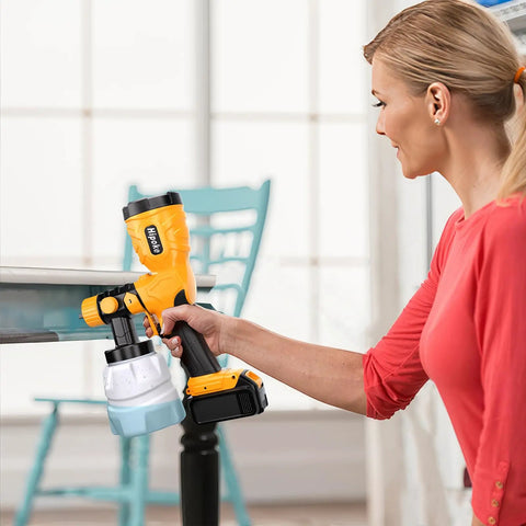 350W Brushless Paint Sprayer Yielding Hella Smooth Finish And No Sweat Operation For DeWalt Batteries Ships With Four Copper Nozzles For Snappy Fence Wall Diy Makeovers in use by a woman