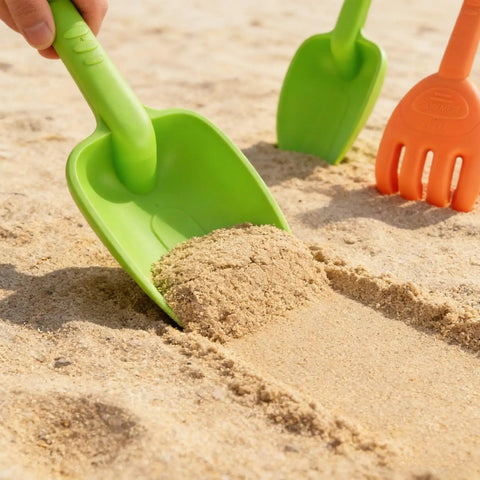 Green shovel from Large Beach Sand Toy Set With Two Shovels And Two Rakes In Mesh Bag Sixteen Point Five Inch Heavy Duty Plastic Four Piece Kit