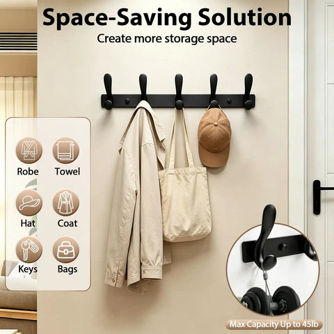 Badass Heavy Duty Wall Hooks Slick Black Metal Coat Hanger And Towel Rack with coats, hats, and bags organized on a wall.